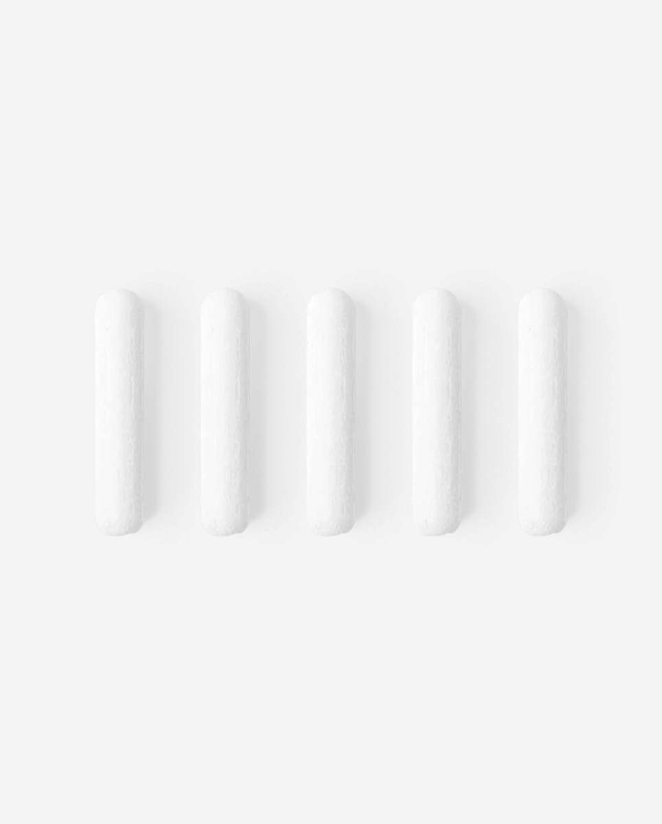 Astrofat set of five 4mm round felt replacement tips for Molotow markers, white fiber material on black background.