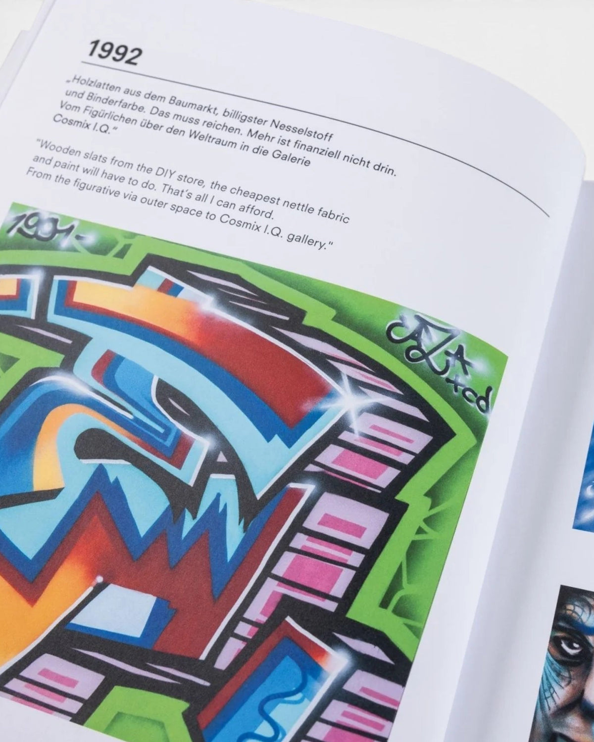 Astrofat DAIM Retrospective book open to a page showing 1992 graffiti art illustrations with English and German text.