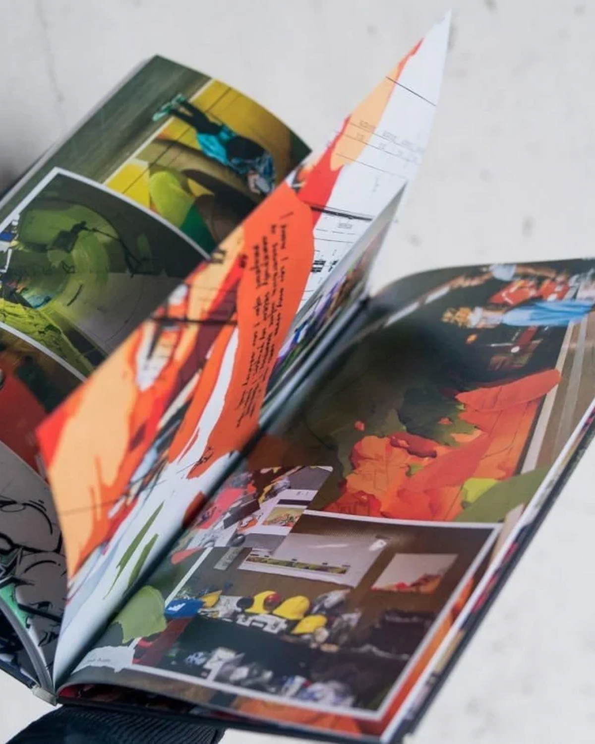 Astrofat DOES First 20 Years hardcover book showing colorful graffiti sketches and personal notes on glossy pages.