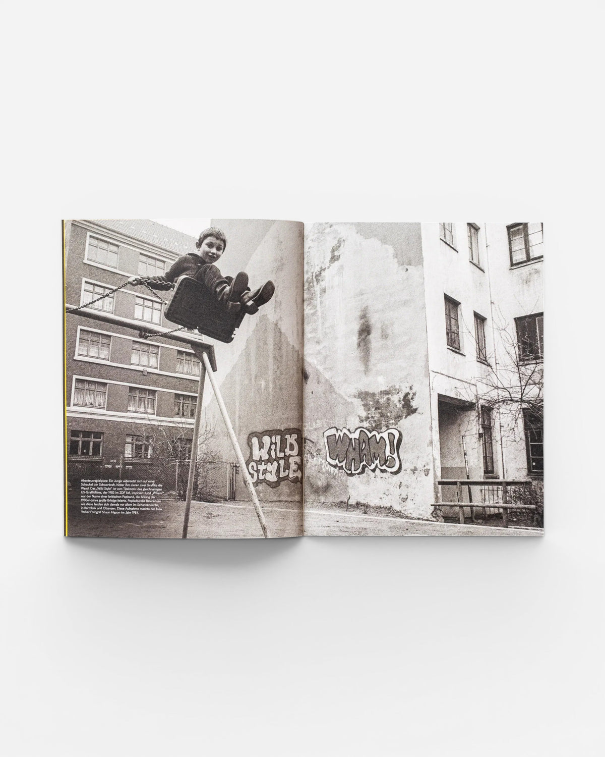 A spread from the Astrofat book EINE STADT WIRD BUNT. FLASHBACK featuring a black and white photo of a boy on a swing.