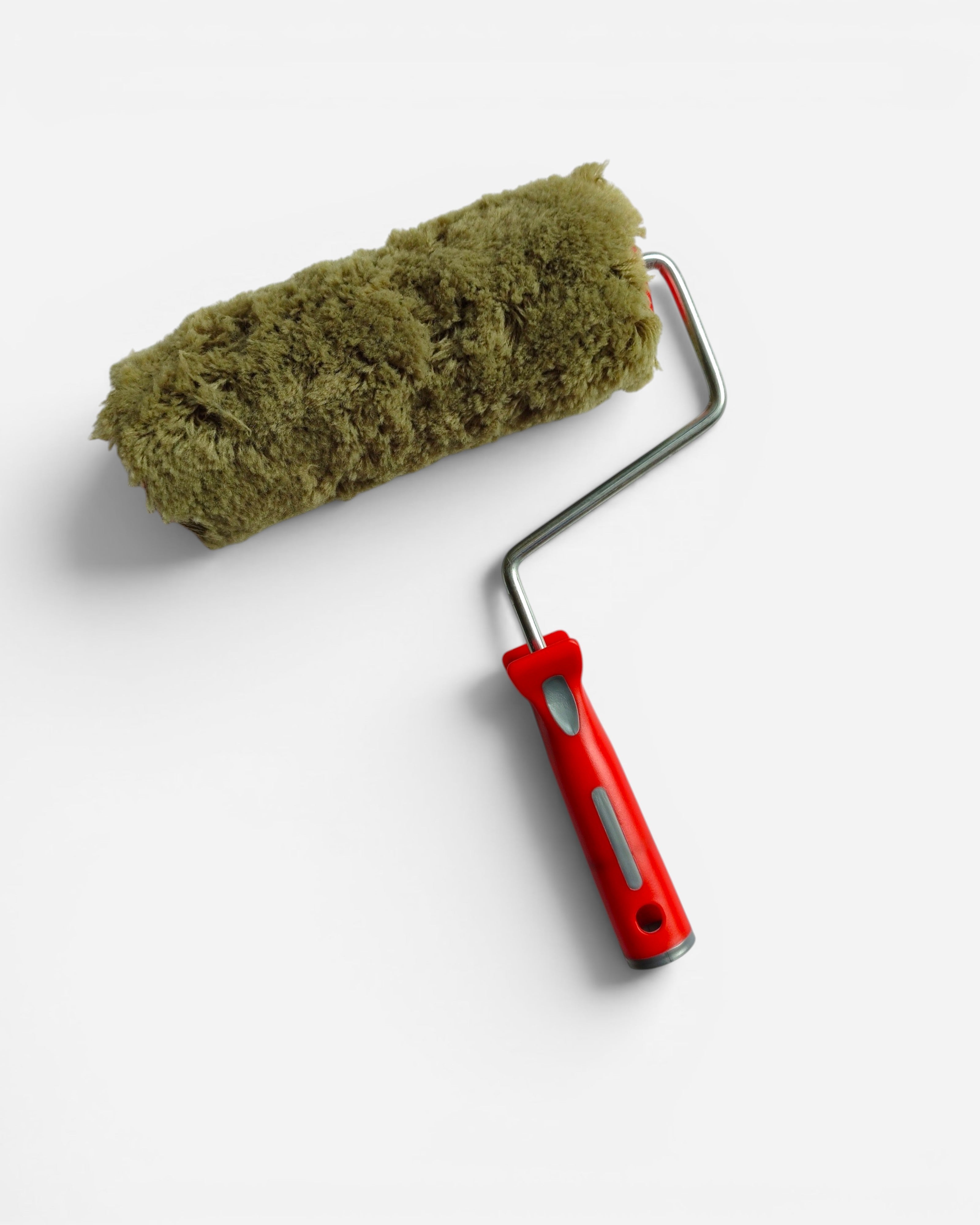 Astrofat 20cm green nylon paint roller with a plush, absorbent nap and a red plastic handle.