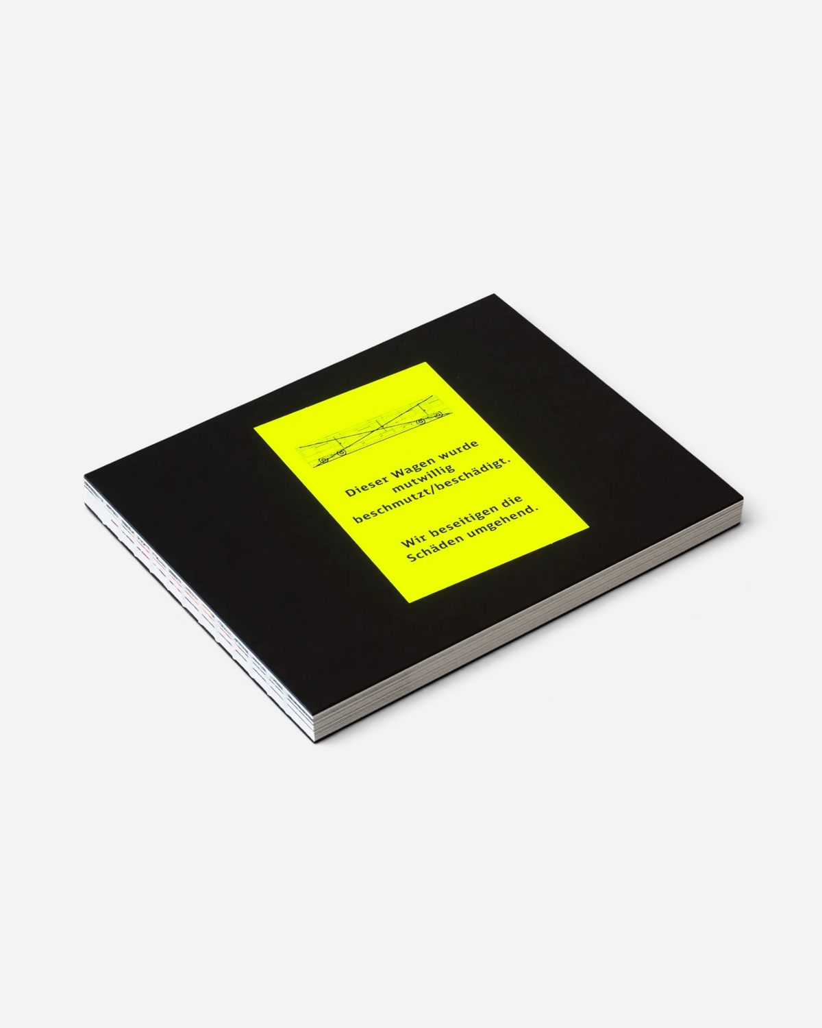 Astrofat Schriftzüge photobook featuring a black hardcover with a neon yellow sticker on the front cover.