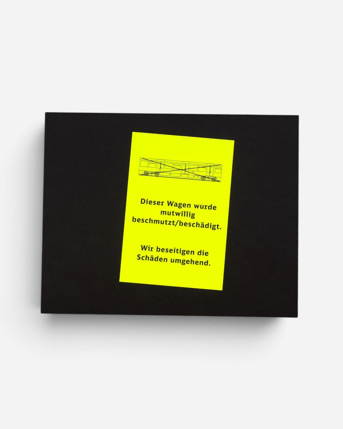 Astrofat Schriftzüge photobook featuring a black cover with a neon yellow warning sticker about graffiti damage.