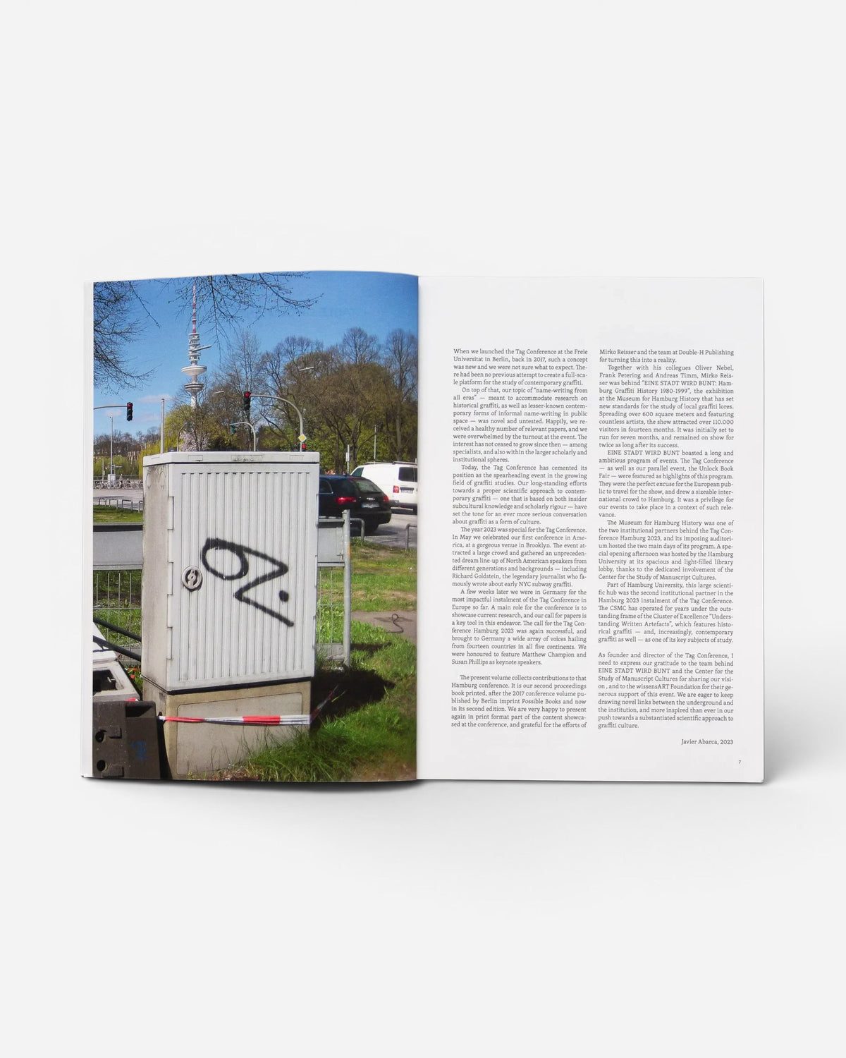 Astrofat TAG Name writing in public space book open to a page featuring text and a photo of graffiti in Hamburg